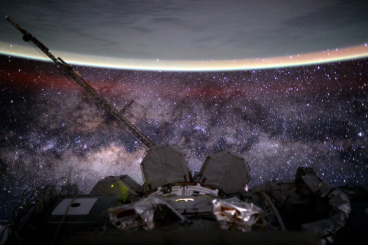 Outer space from the International Space Station at 400 km (250 mi) altitude in low Earth orbit. In the background the Milky Way's interstellar space is visible, as well as in the foreground, above Earth, the airglow of the ionosphere just below and beyond the so-defined edge of space the Kármán line in the thermosphere. Credit: NASA/Scott Kelly