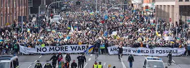 Photo: Thousands of demonstrators join Fridays for Future’s global day of action to stand with Ukraine by walking down Willy-Brandt-Strasse, a main thoroughfare in Hamburg, Germany. (Photo: Daniel Reinhardt/dpa/picture alliance via Getty Images)