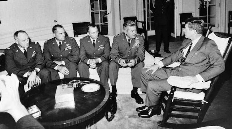 Photo: President Kennedy meets in the Oval Office with General Curtis LeMay and the reconnaissance pilots who found the missile sites in Cuba. Credit: CIA, Wikipedia Commons